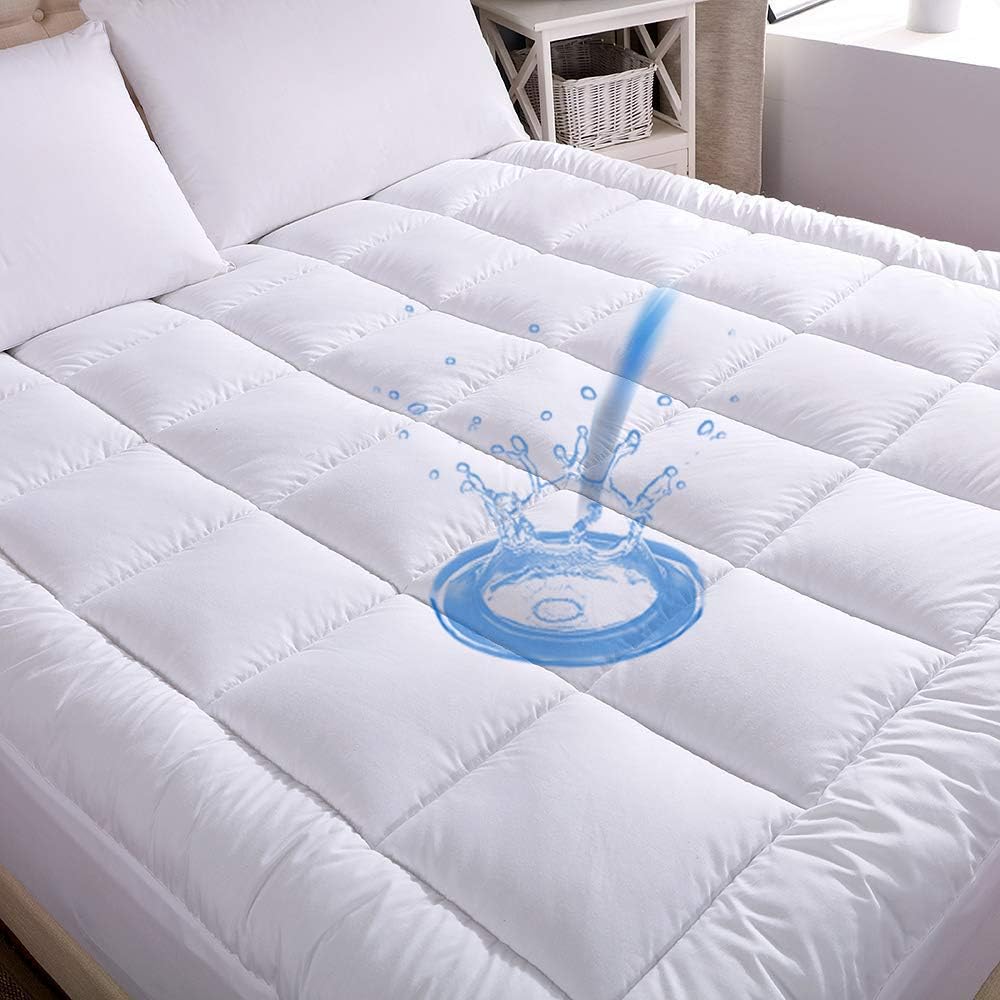 A full size mattress pad with a waterproof bottom, depicted with a graphical representation of water being repelled by the mattress material.